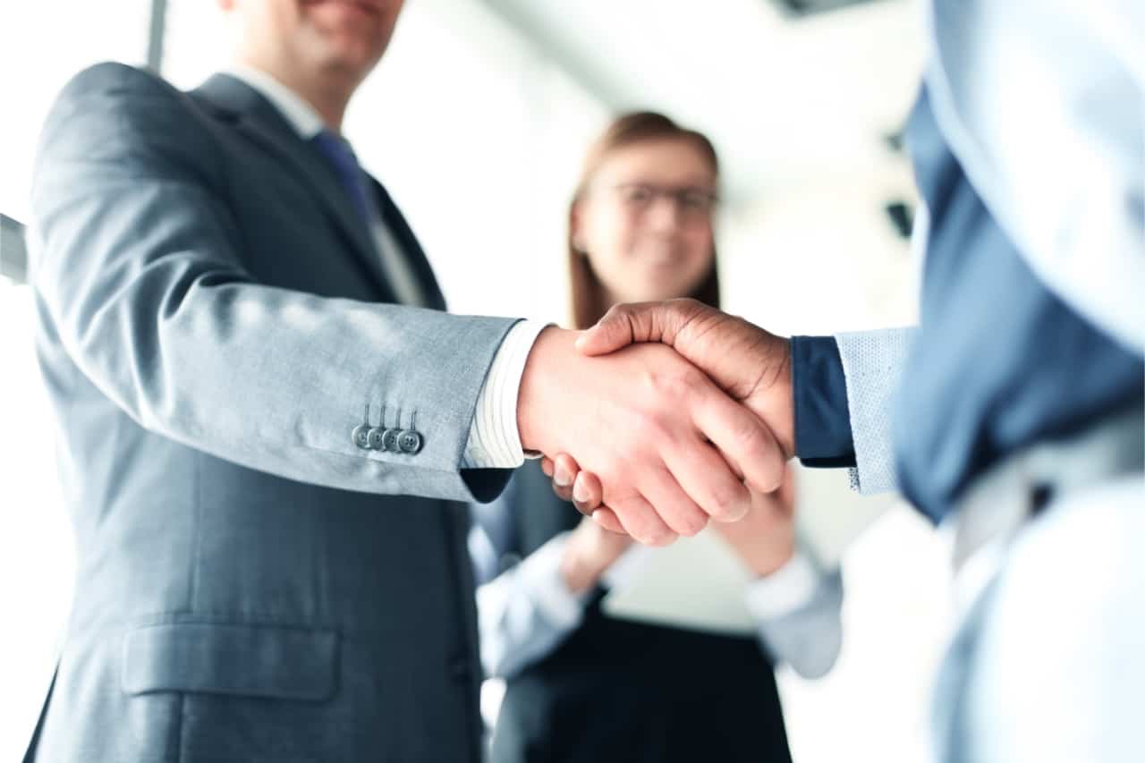 Image of our hard money lenders in Boston MA shaking hands with a new client
